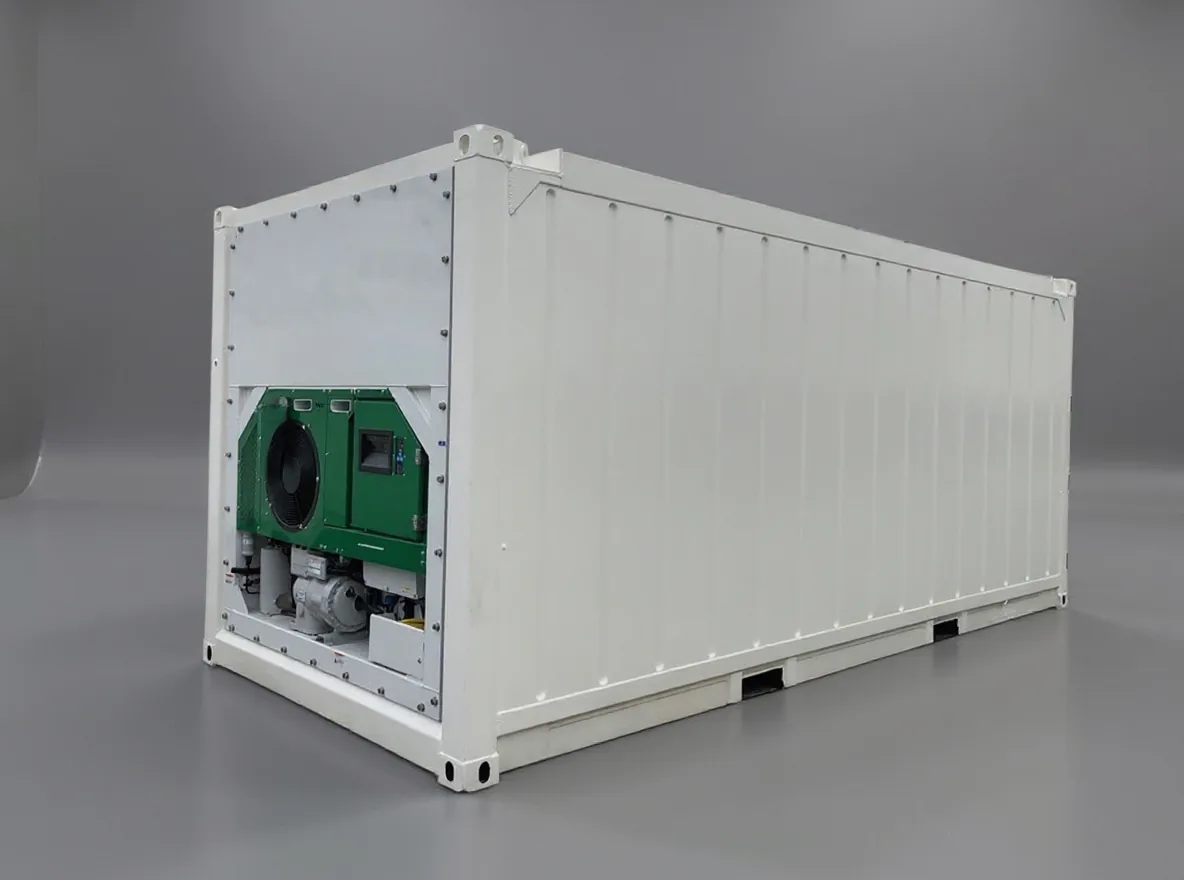White offshore reefer seen from the side, its green refrigeration unit exposed at the machinery end